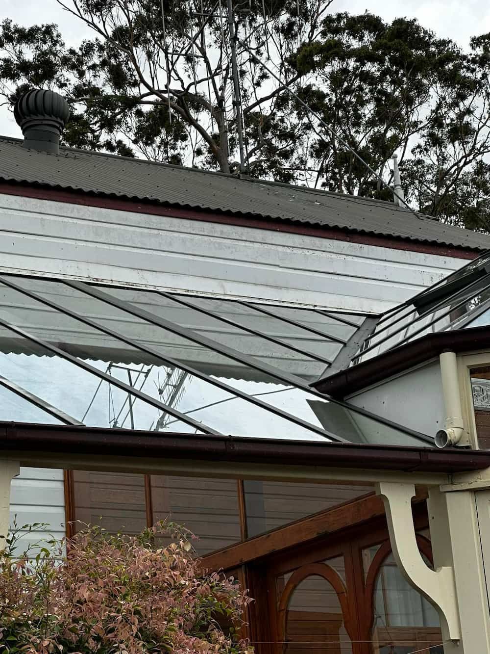 A House With a Glass Roof and Trees in the Background — Lighthouse pressure washing in Wauchope, NSW