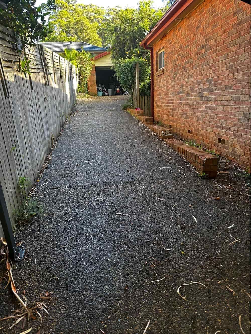 A Gravel Driveway Leading to a Brick House — Lighthouse pressure washing in Wauchope, NSW