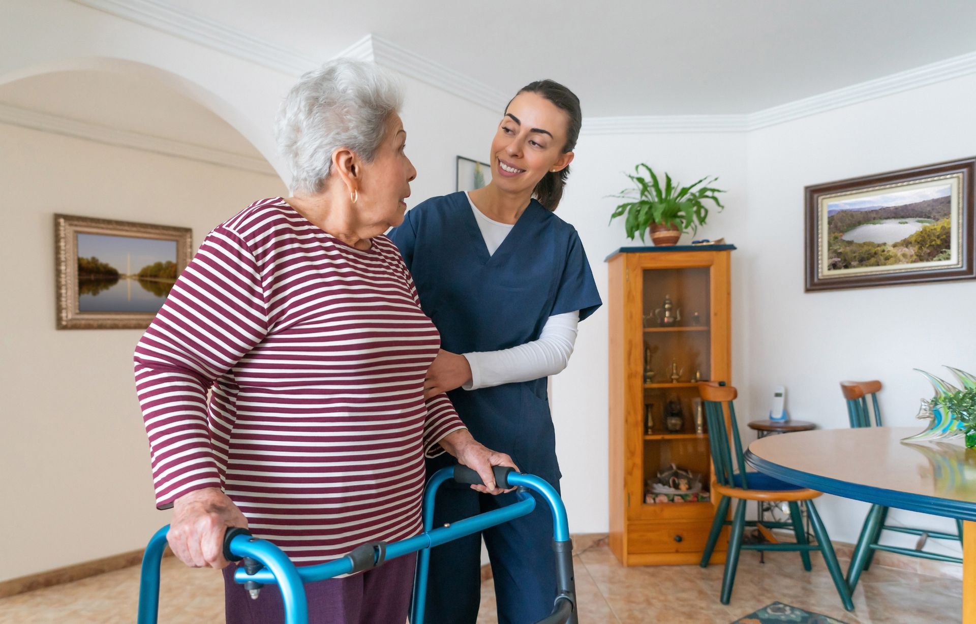 Caregiver assisting elderly woman with walker in a comfortable home setting | Fort Worth, TX 