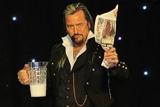 magician holding a mug