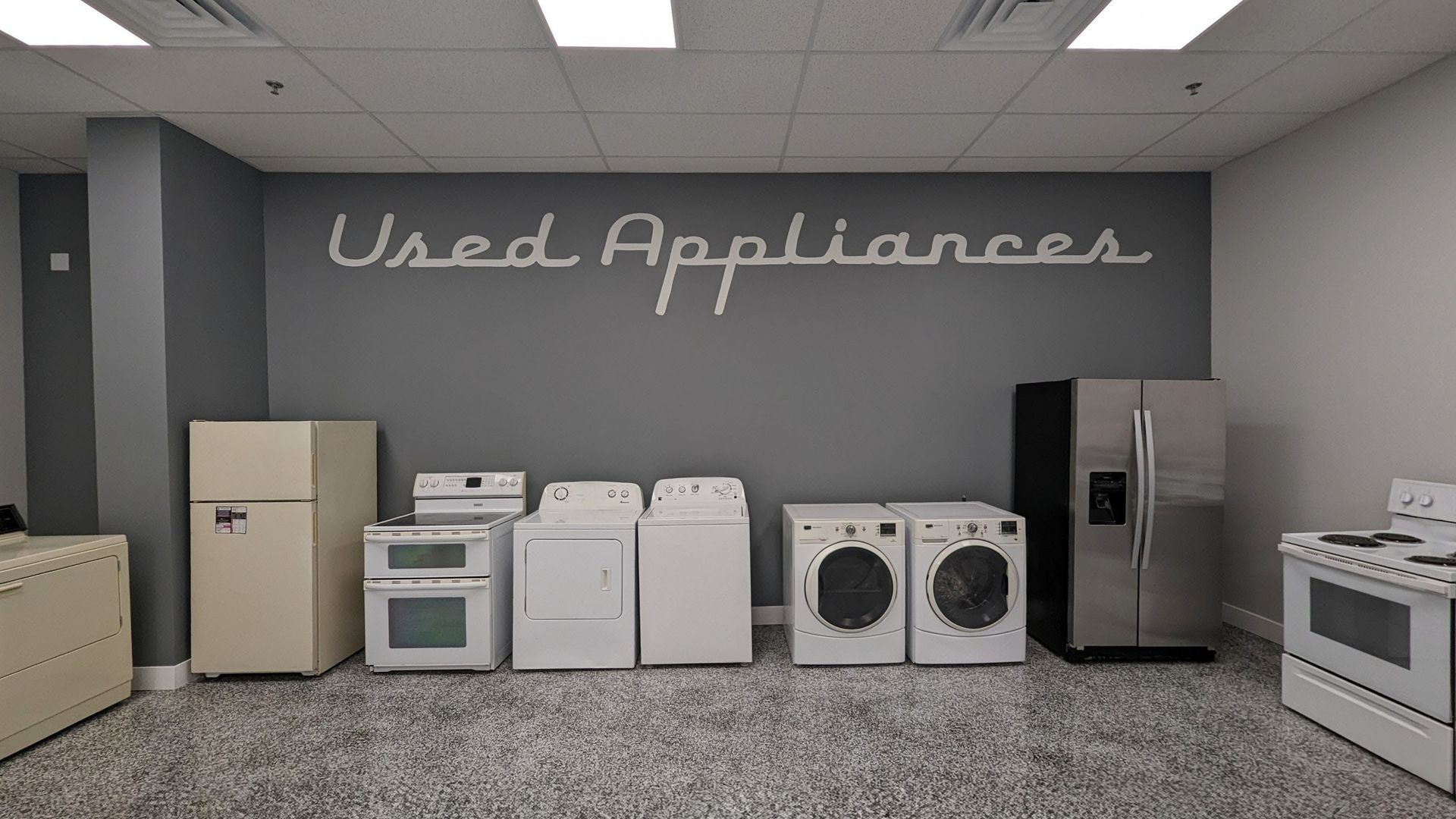 A display of used appliances in a store