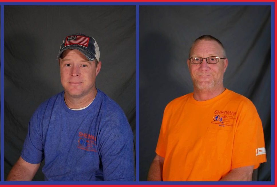 Two men standing next to each other wearing blue and orange shirts