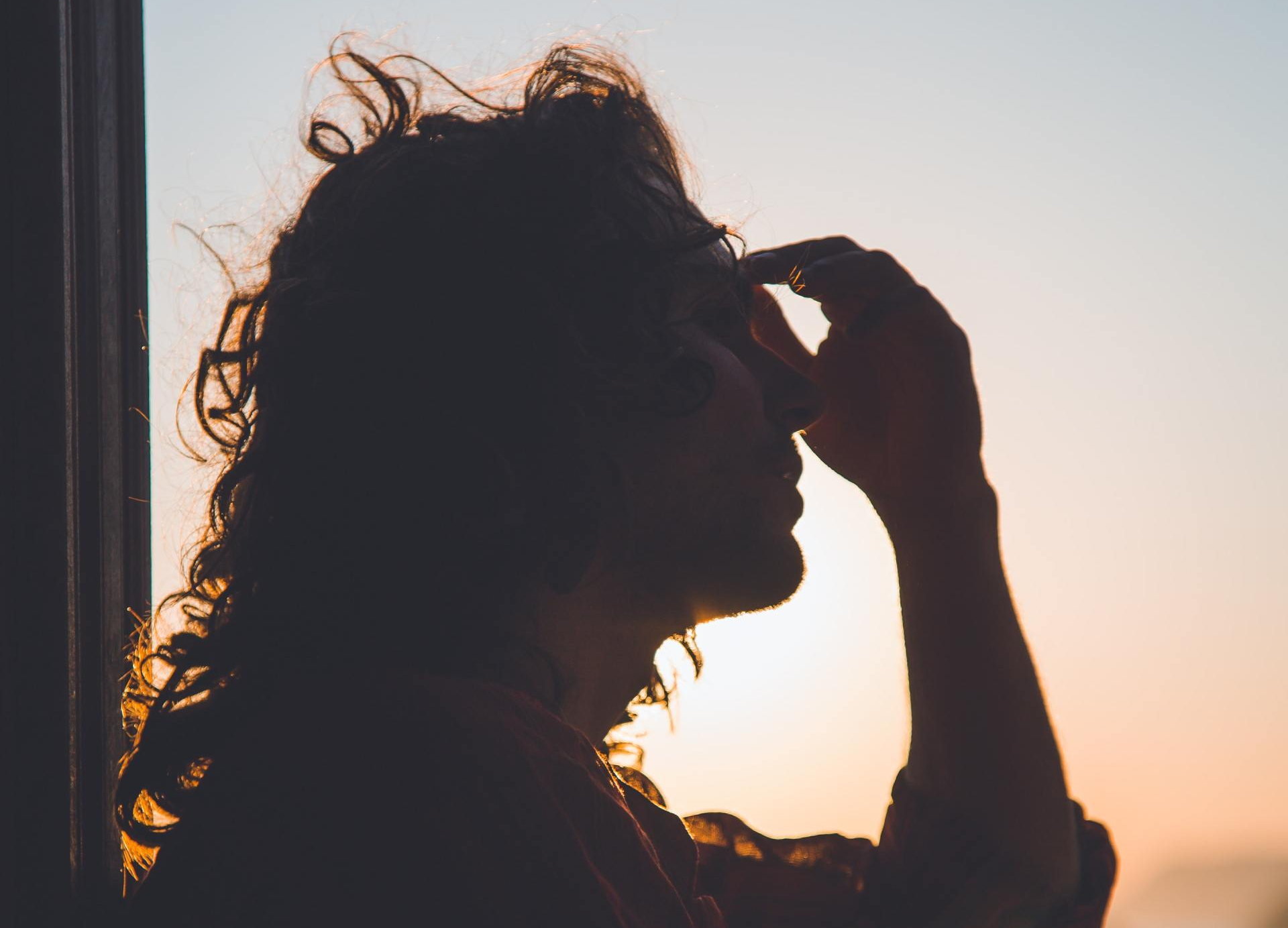 Women with her hand on her forehead 