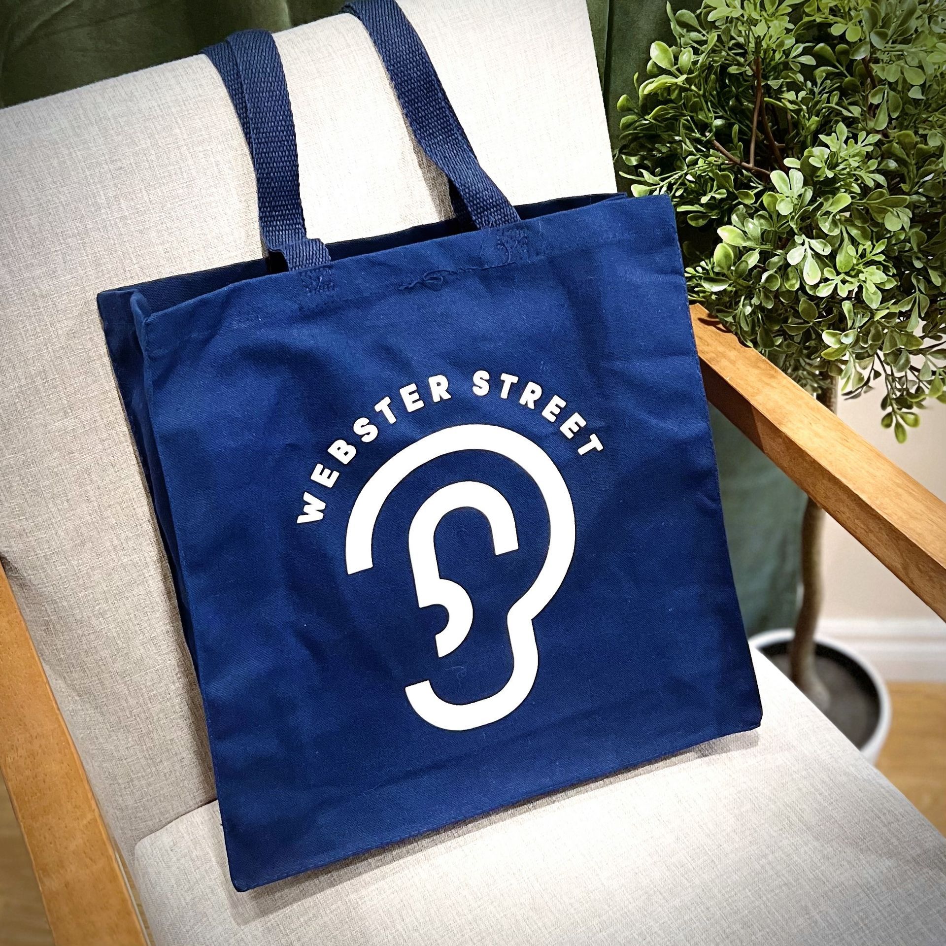 A tote bag showing the Webster Street Hearing Boutique logo.