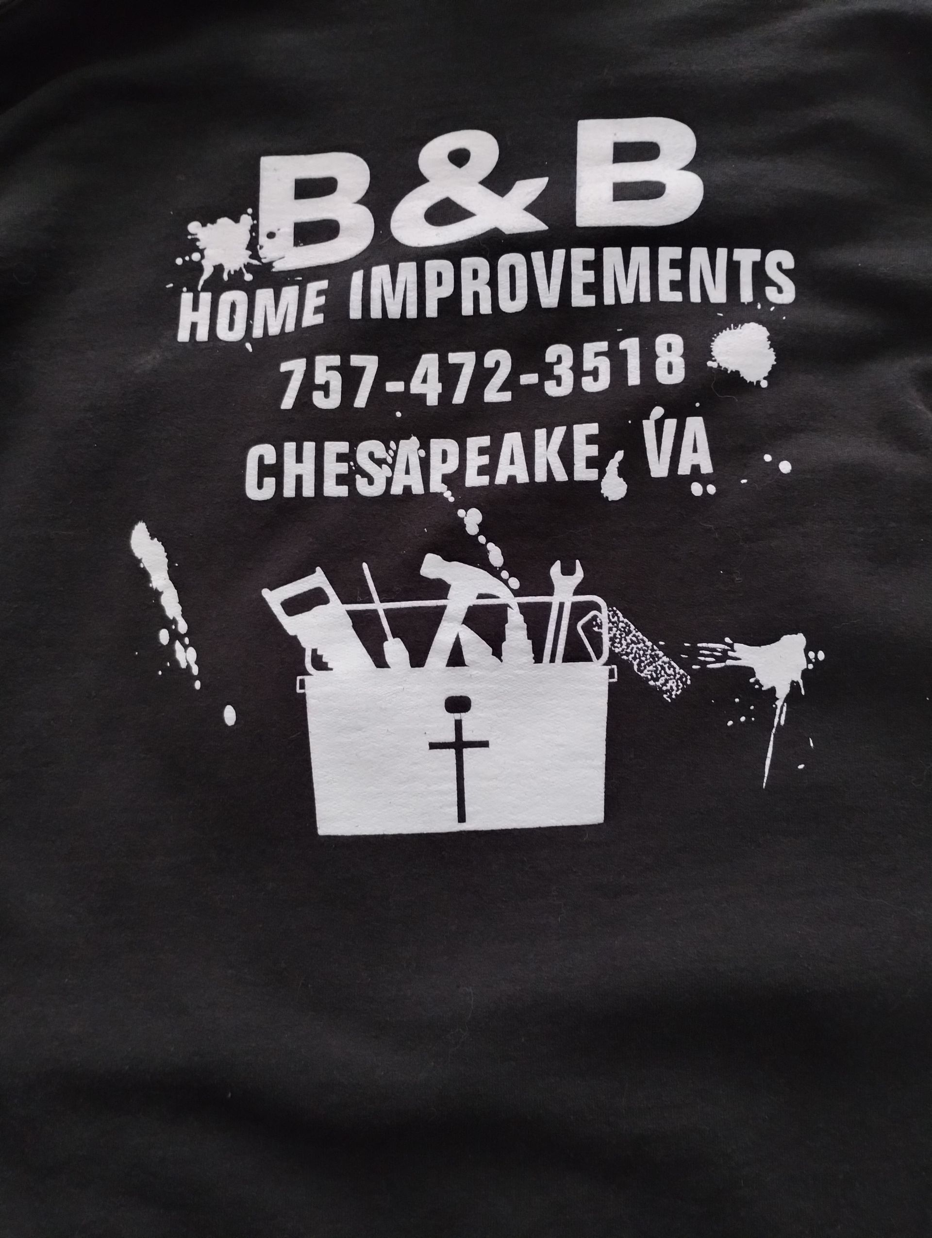 Black t-shirt with white B&B Home Improvements logo: name, phone number, Chesapeake VA, toolbox with tools.