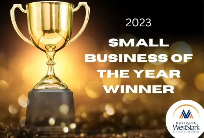 A gold trophy with the words `` small business of the year winner '' written on it.
