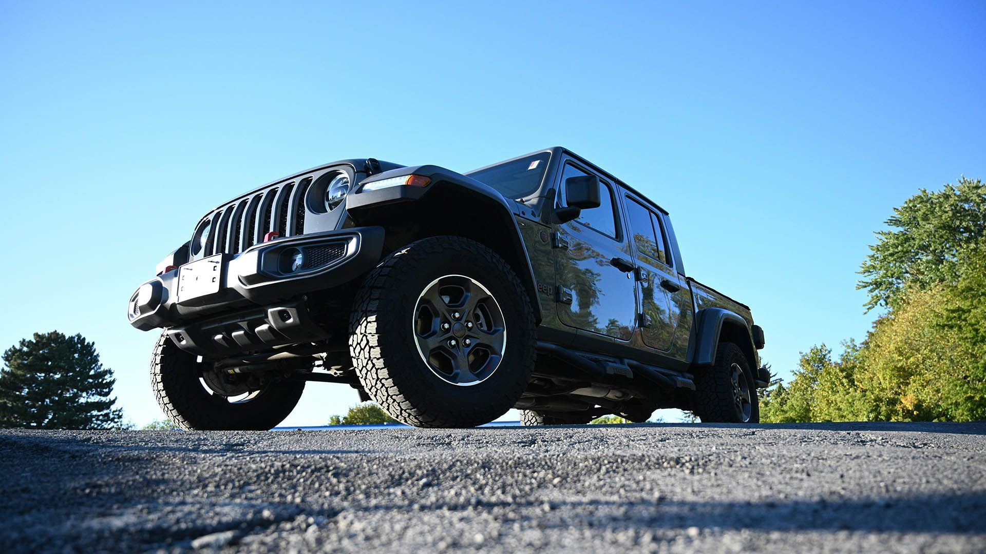 A jeep is parked on the side of the road.