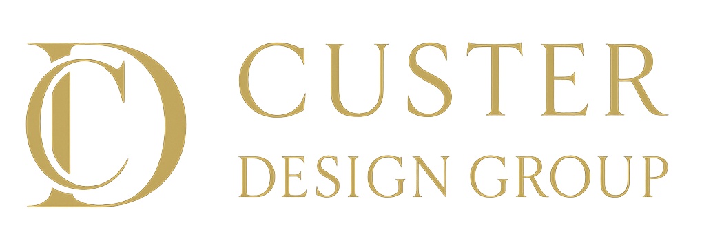 Gold logo for Custer Design Group: initials 