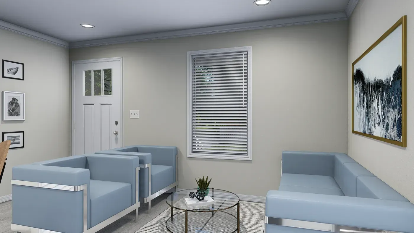 A light blue living room with matching furniture, a white door, and framed artwork on the walls.