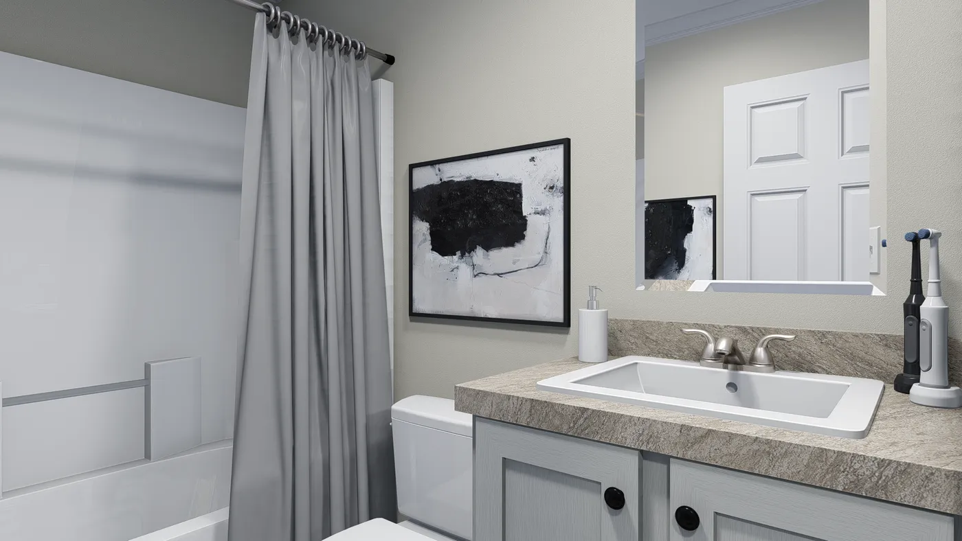 Bathroom interior with a white sink, counter, and abstract artwork. Grey walls and shower curtain.