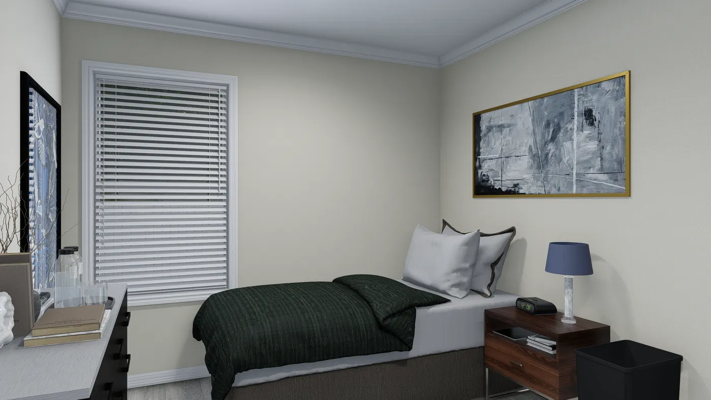 Small bedroom with a bed, desk, window, and nightstand. Green bedding, art on wall, neutral walls.