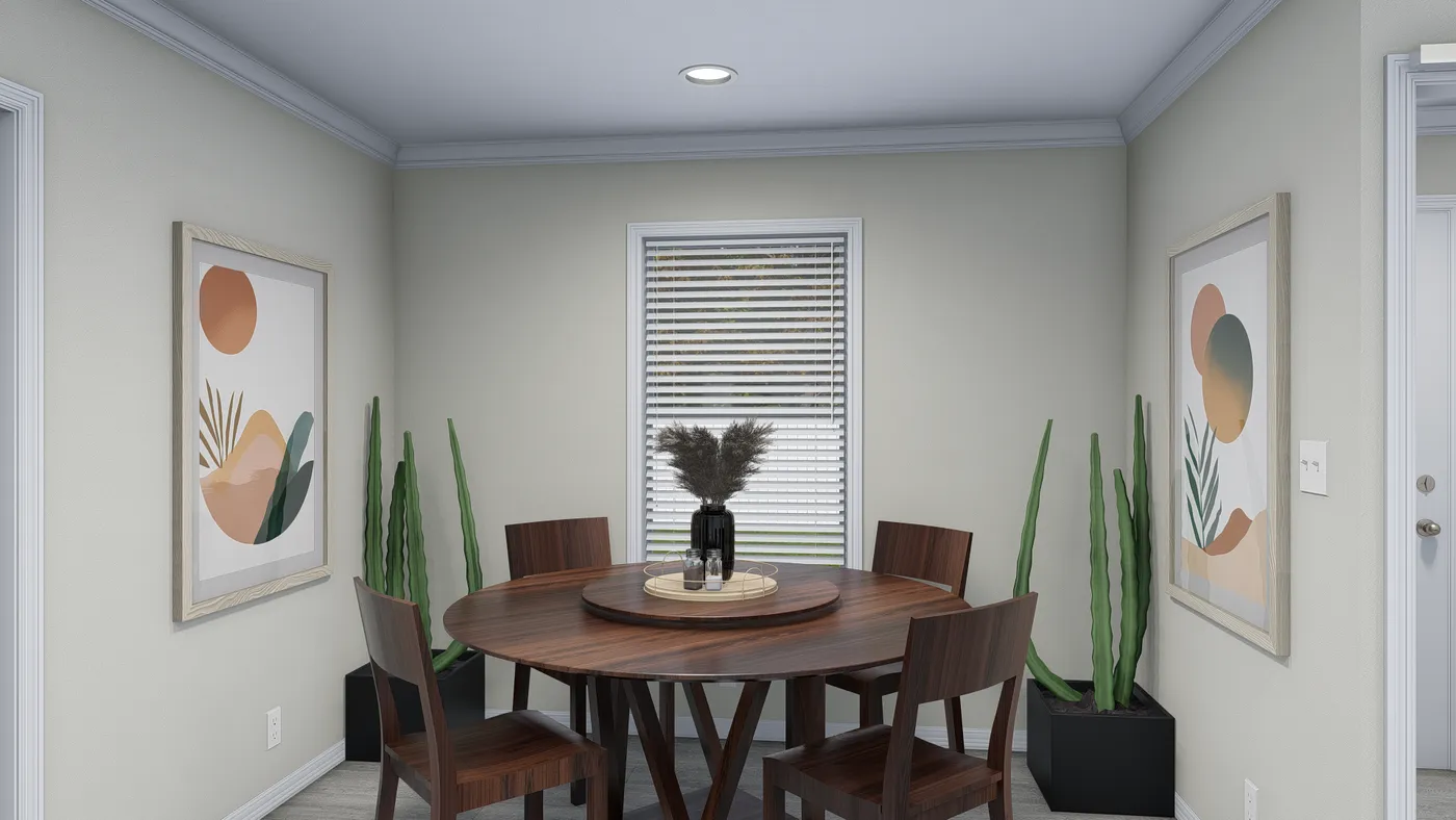 Dining room with round wooden table, chairs, art, plants, and window with blinds.