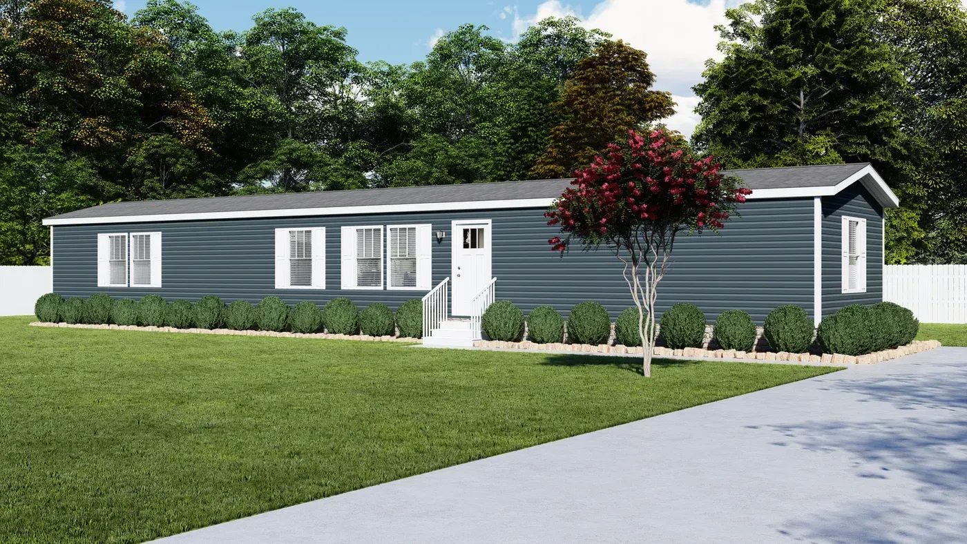 Blue modular home with white trim and landscaping; sunny day.