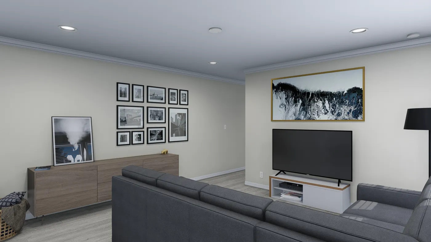 Living room with gray sofa, TV, gallery wall, and a wood console.