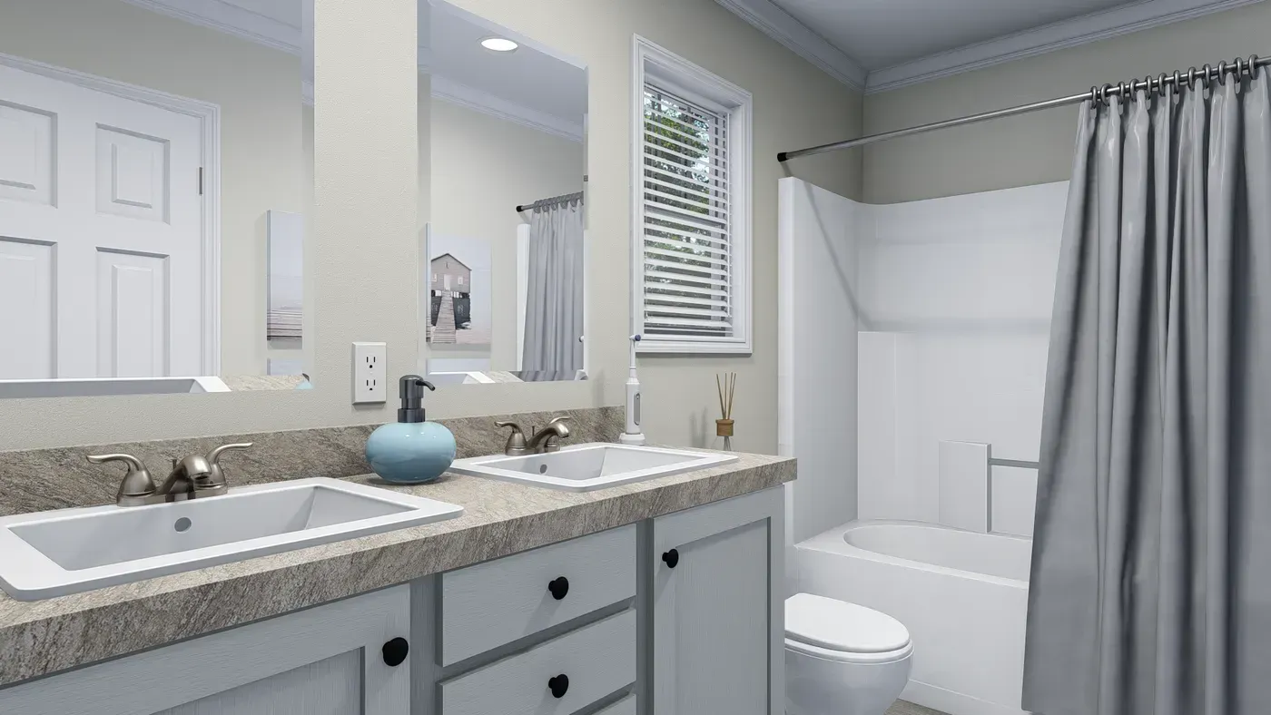 Bathroom with double vanity, bathtub, and toilet; gray and white color scheme.