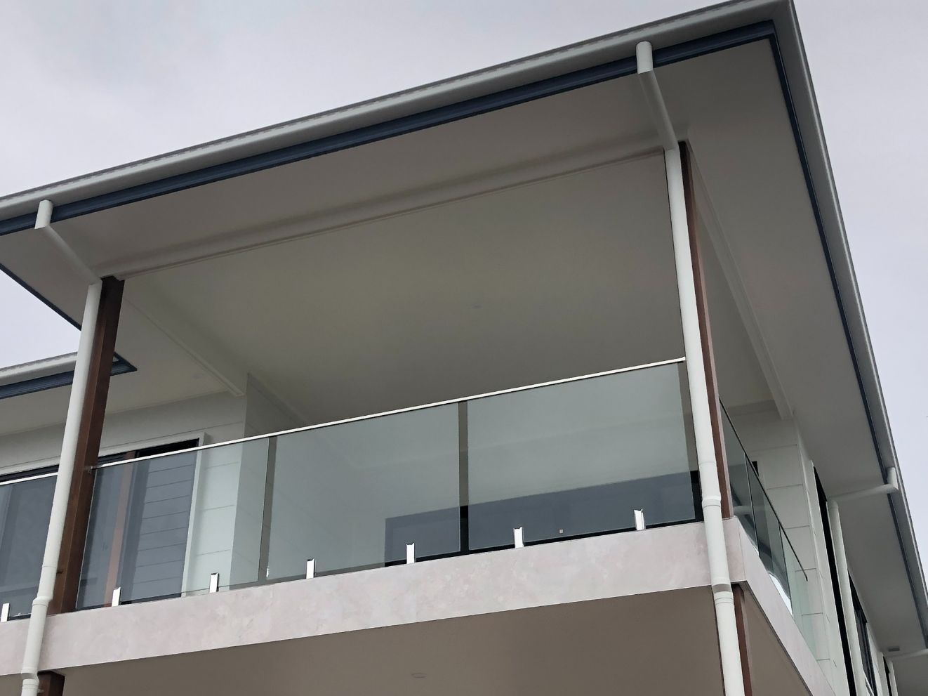 White House with Glass Balustrade — Pool Fences in Taree South, NSW