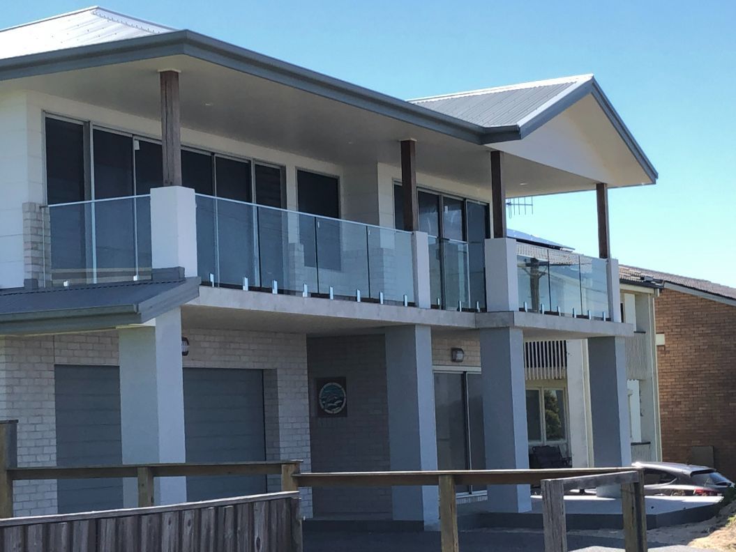 House with Glass Balustrade — Pool Fences in Taree South, NSW