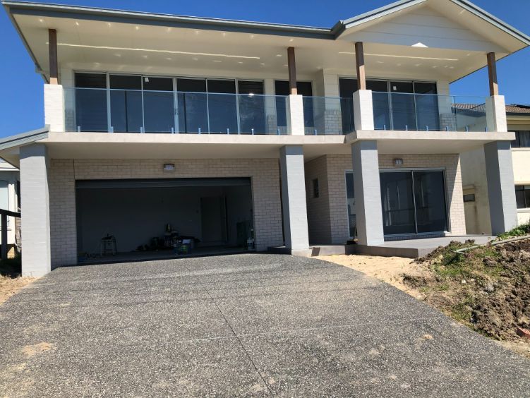 House with Driveway Garage — Pool Fences in Taree South, NSW
