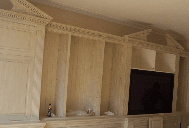 stunning wooden bookcase with fitted television
