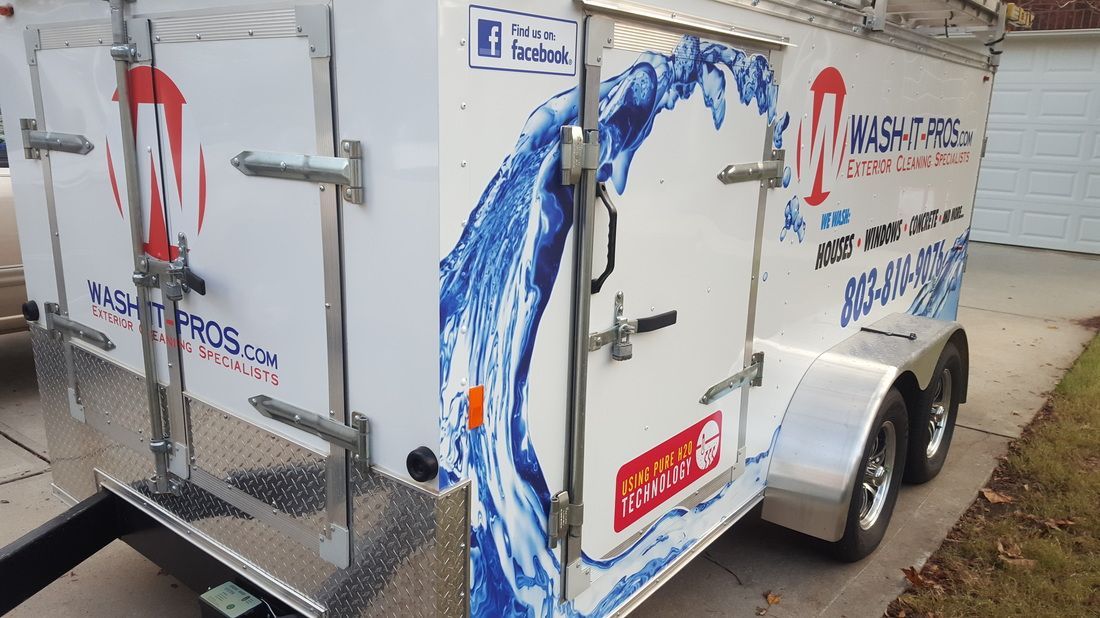 A white utility trailer branded 