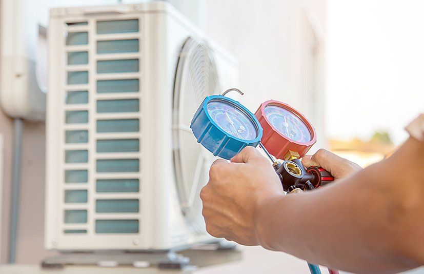 Examining Air Conditioner — Crossett, AR — Master Technicians & Mechanicals LLC