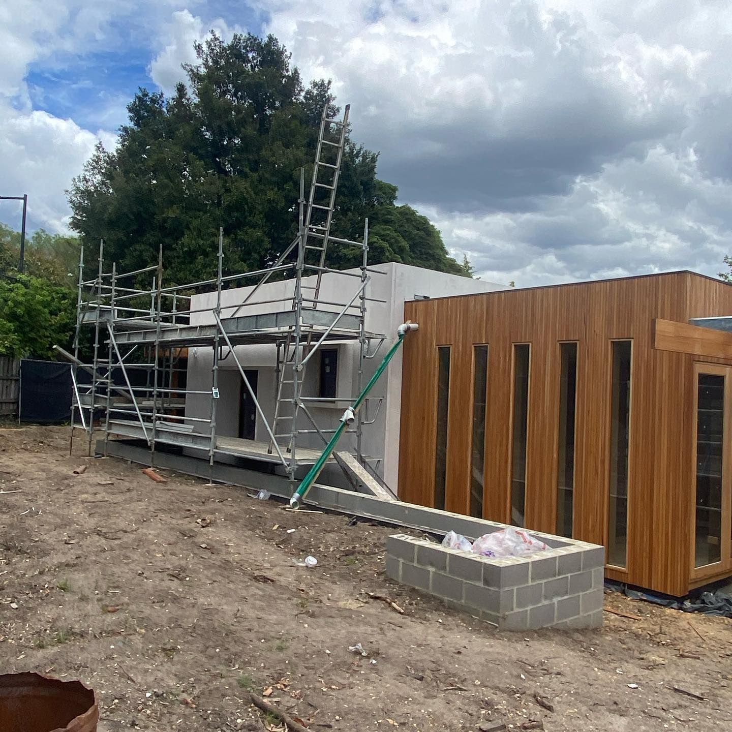 A house that is being built with scaffolding around it