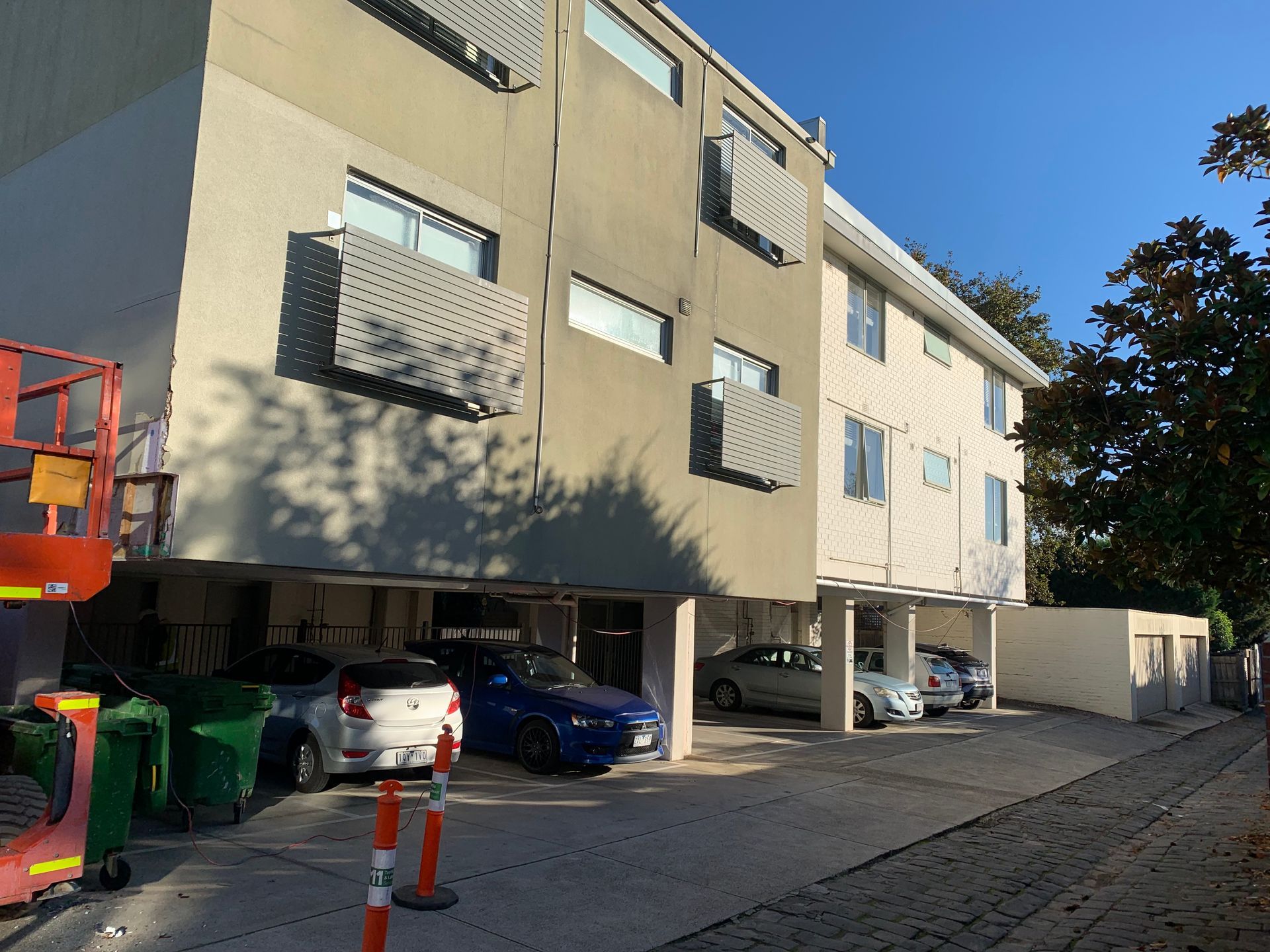 A building with cars parked in front of it
