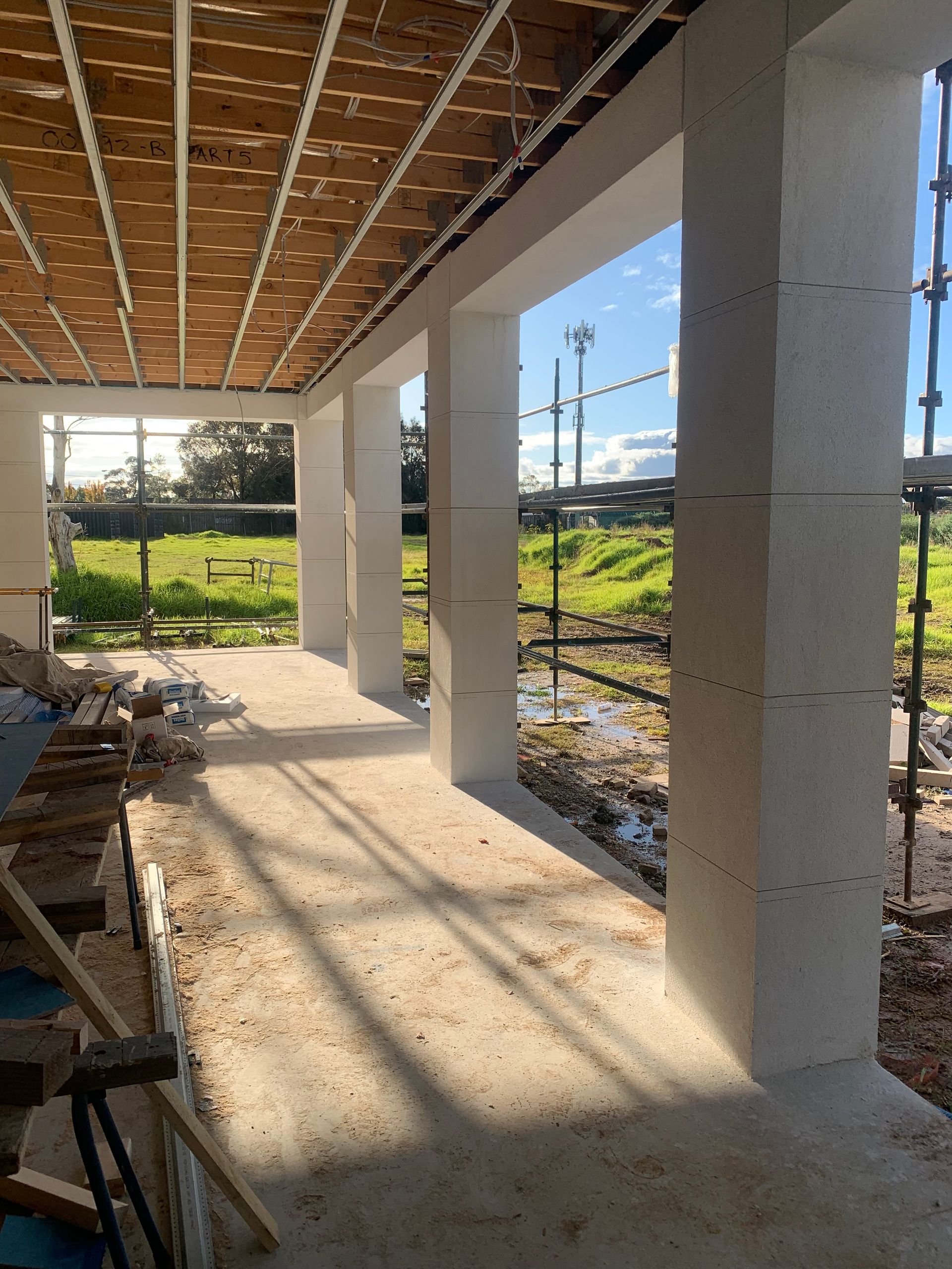 A building under construction with a lot of windows and scaffolding
