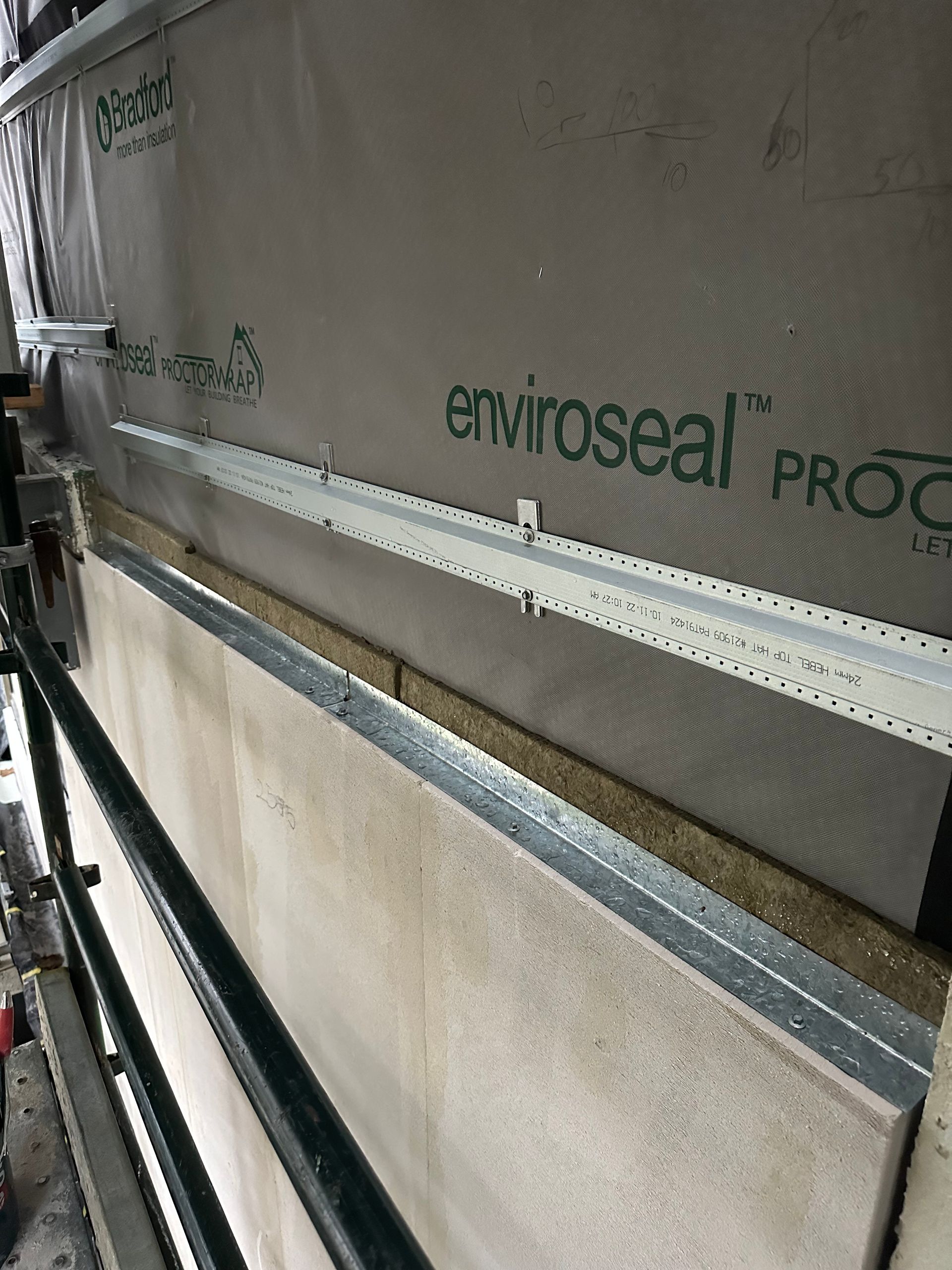 A wall with a piece of paper that says ' enviroseal pro ' on it