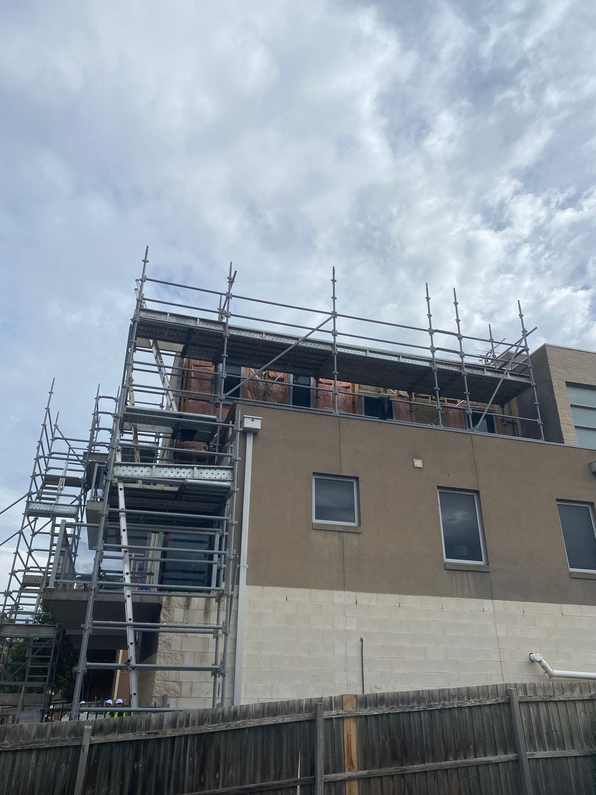 A building under construction with scaffolding on top of it
