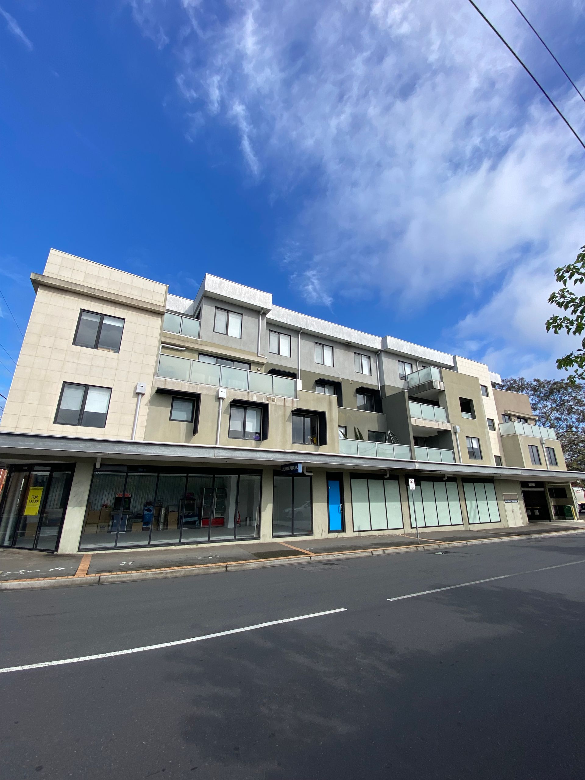 A large building with a blue door on the side of it