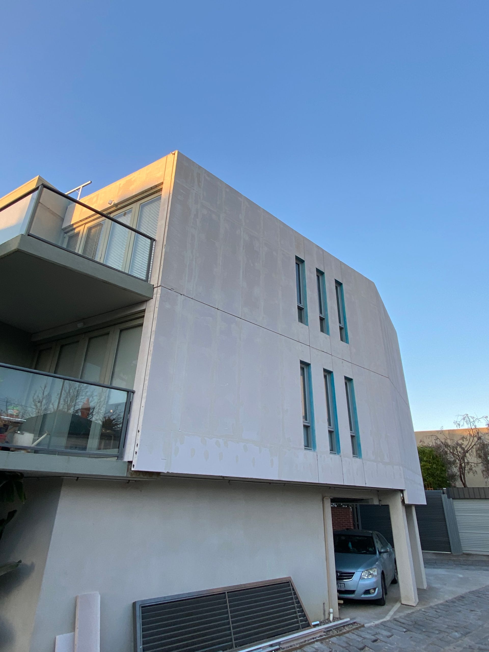 A building with a car parked in front of it