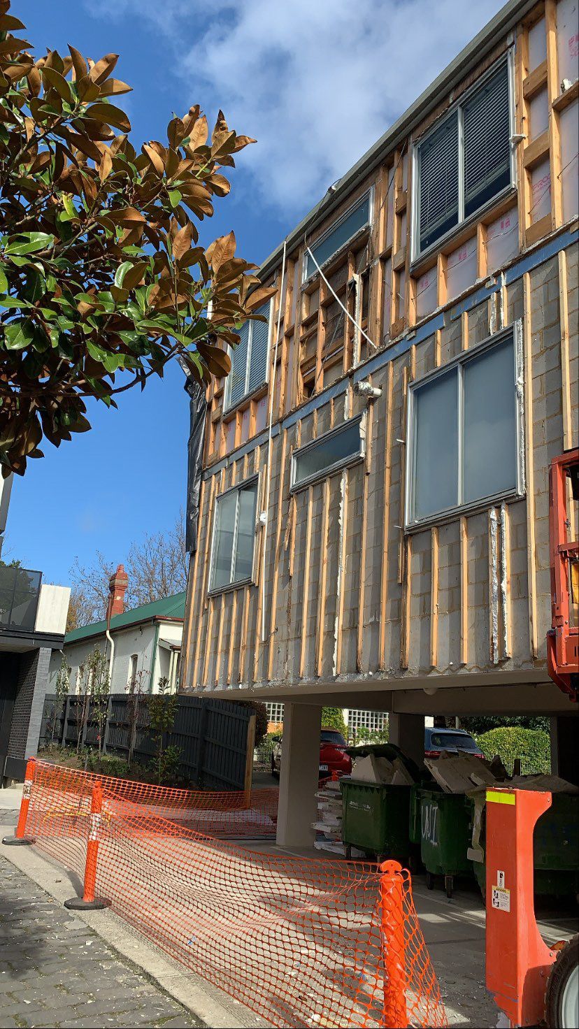 A building with a lot of windows is being built.