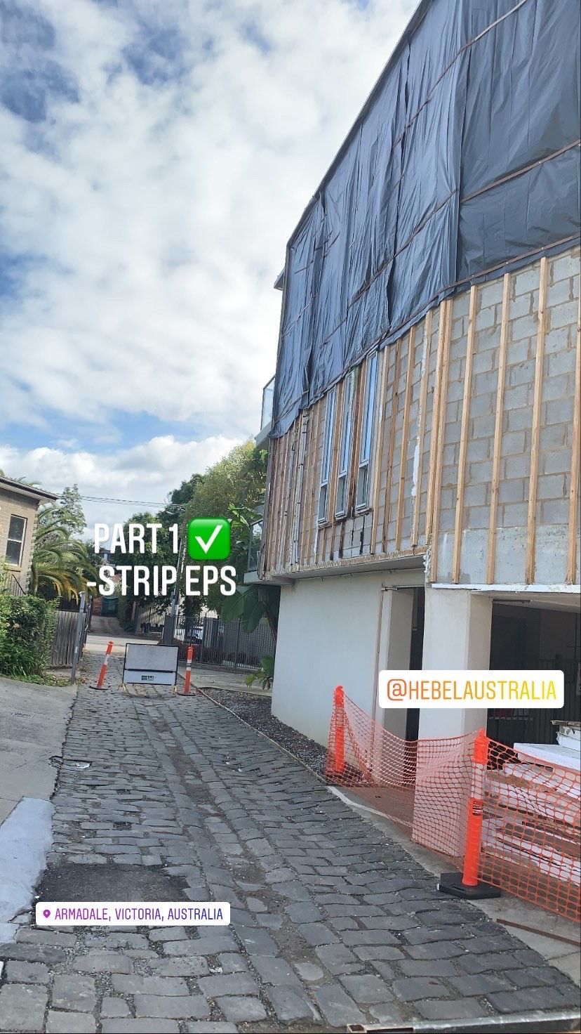 A building that is being built with a lot of stripes on it.