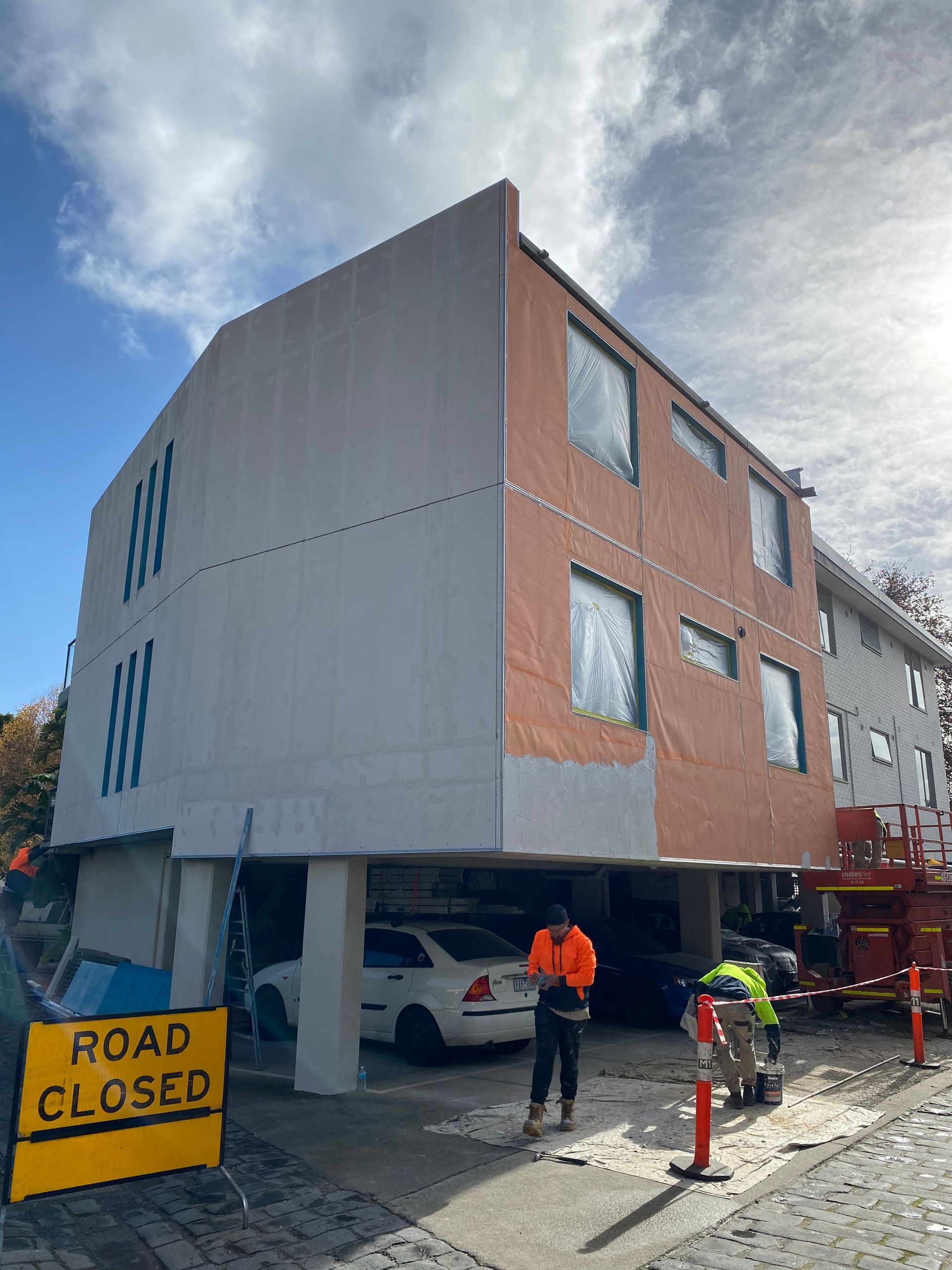 A building with a road closed sign in front of it