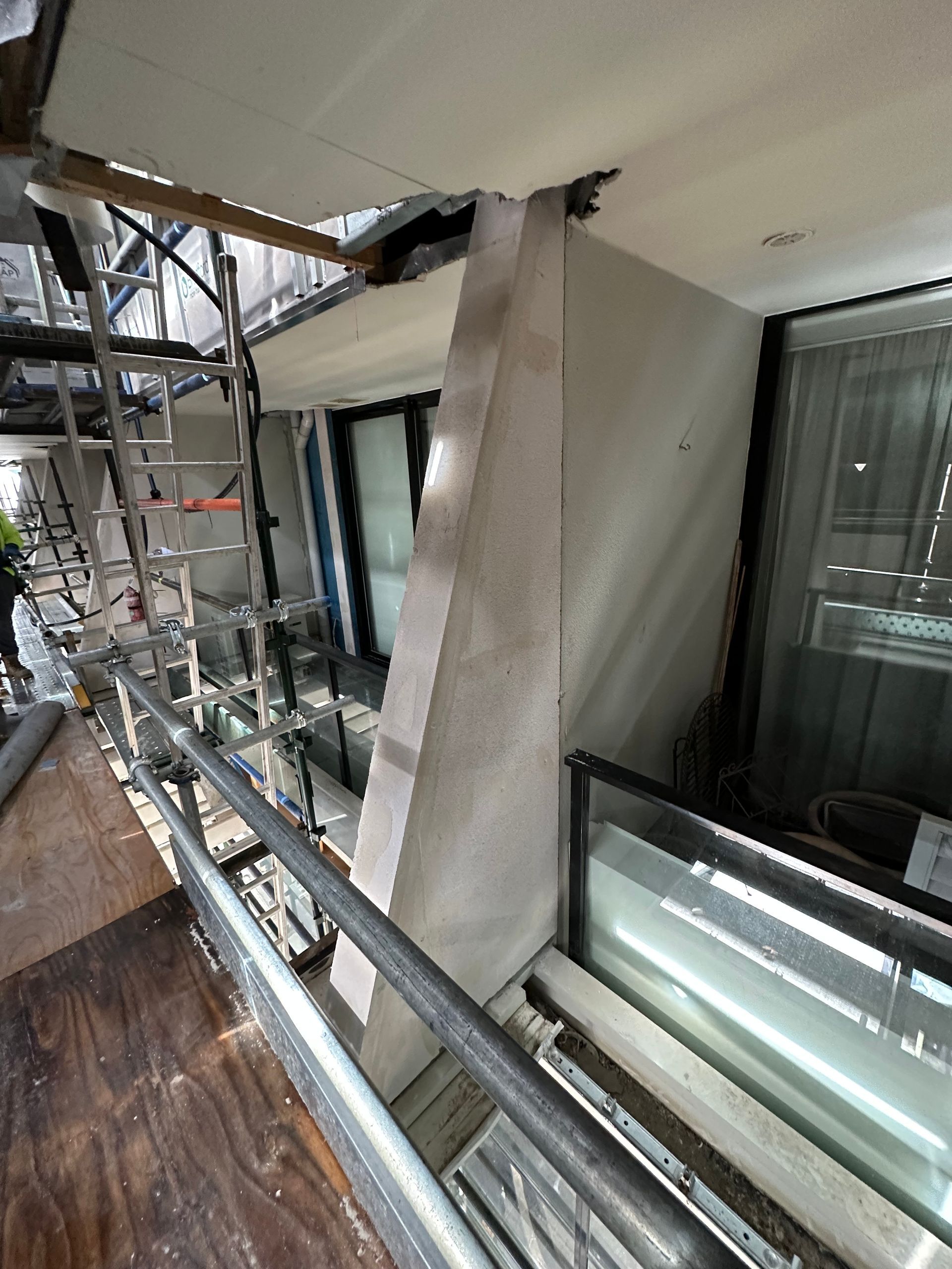 A balcony with a ladder going up to it