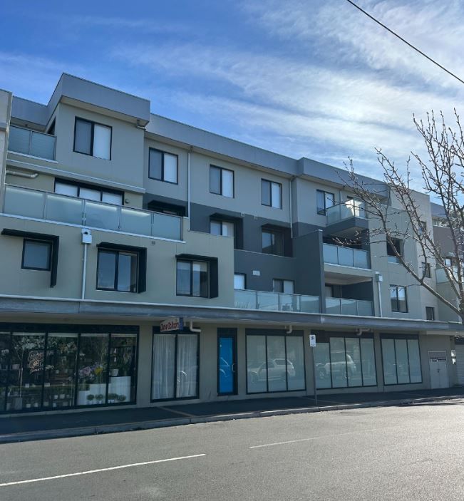 A large building with a lot of windows and balconies