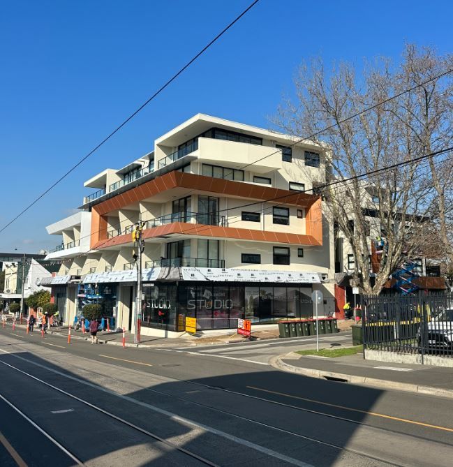 A large building with a sign that says ' la station ' on it