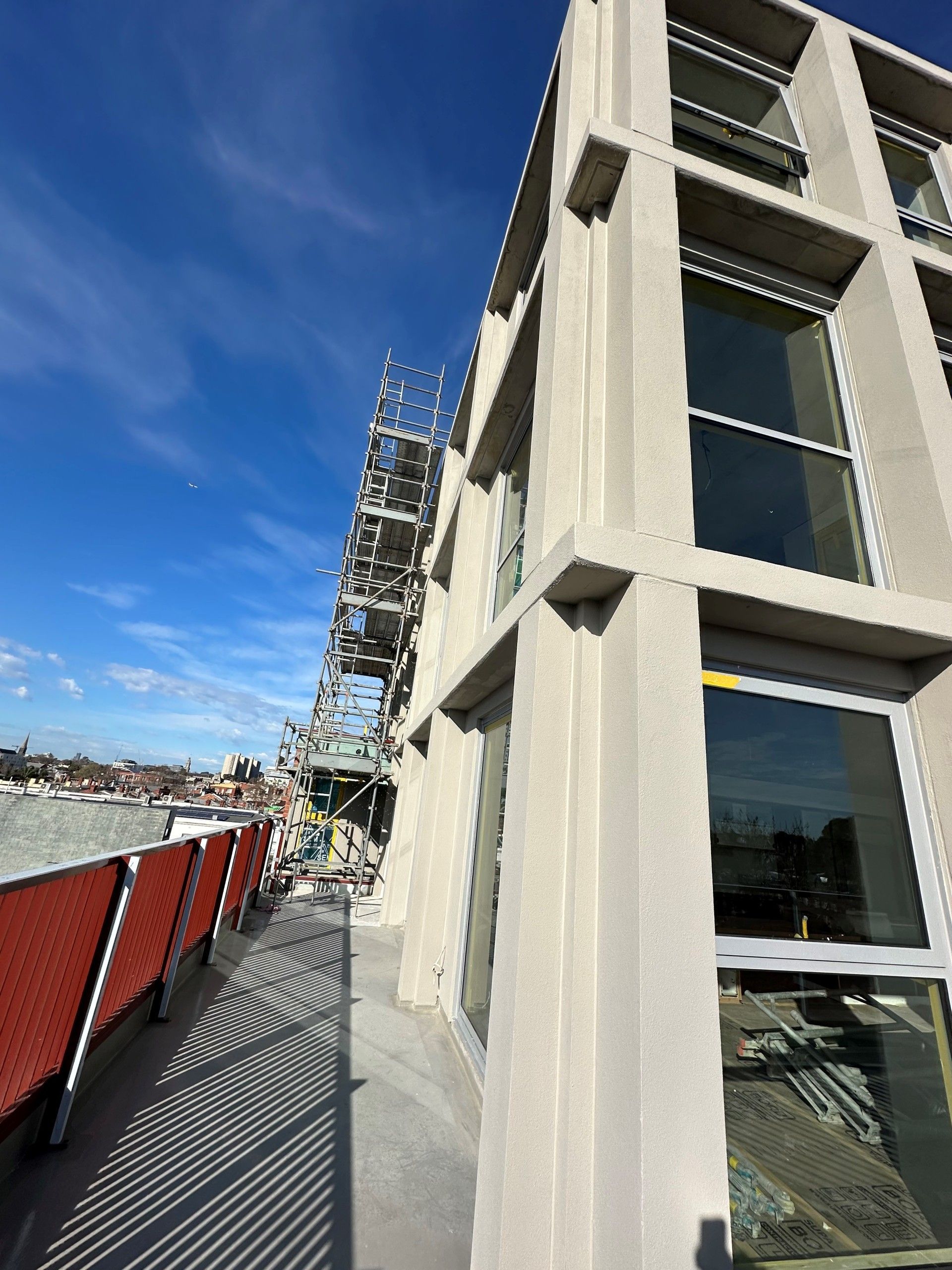 A building under construction with scaffolding on the side of it