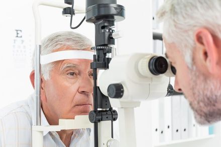 Optometrist doing sight testing for senior patient — Eye Care in Brick, NJ