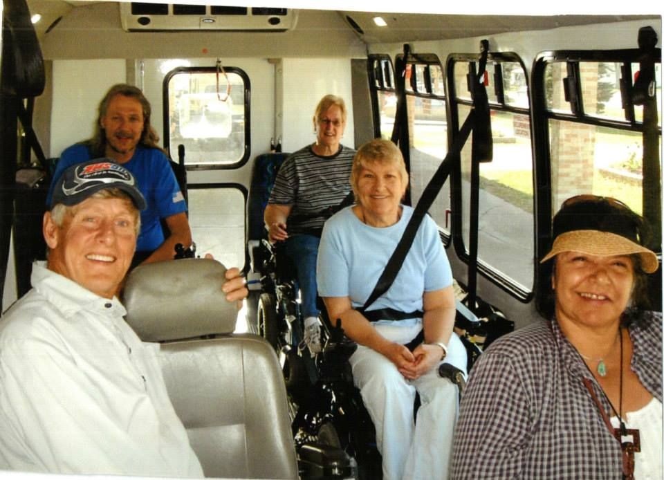 happy passengers in a Handi-wheels bus