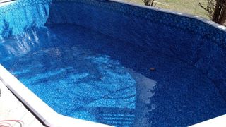 A large swimming pool filled with blue water.