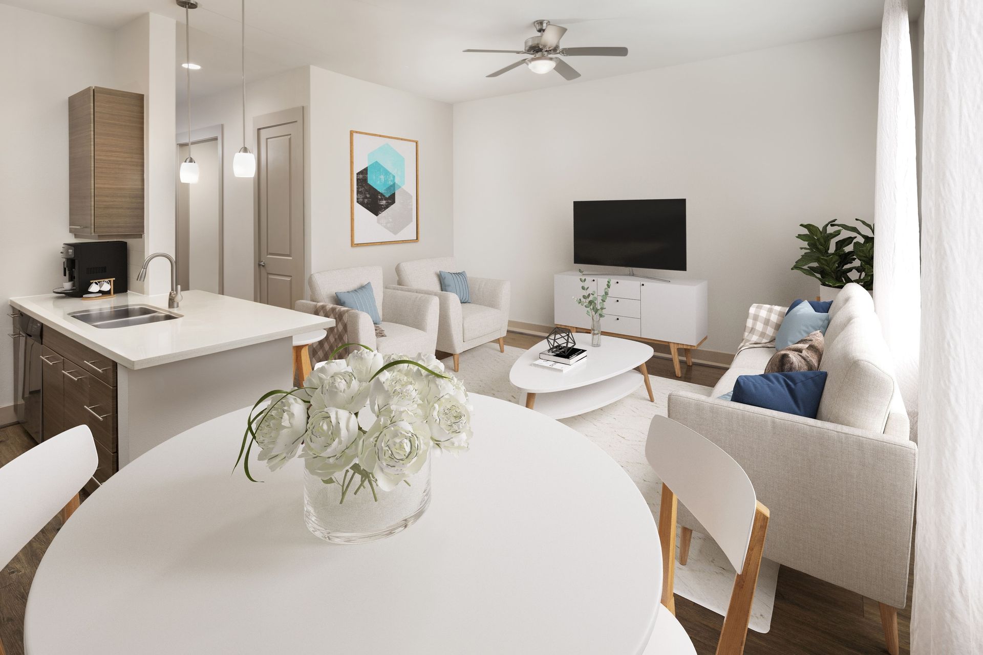 Modern living room with open kitchen, featuring a sofa, coffee table, and a small dining area at Marquis Enclave, offers apartments for rent in Midtown Houston, TX.