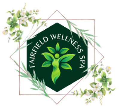 A logo for fairfield wellness spa with flowers around it