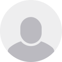 A gray circle with a silhouette of a person in it.