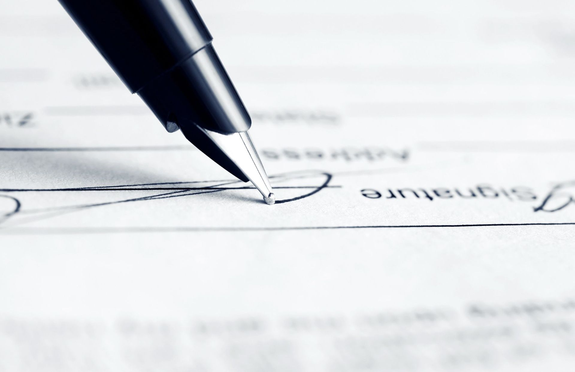 picture of a ballpoint pen signing a contract