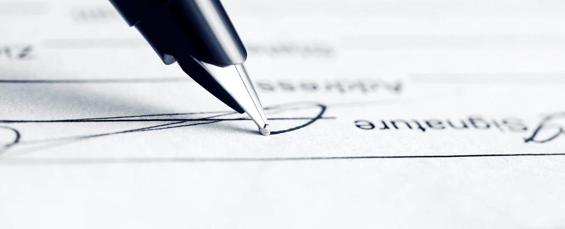 Ballpoint pen signing a lease document