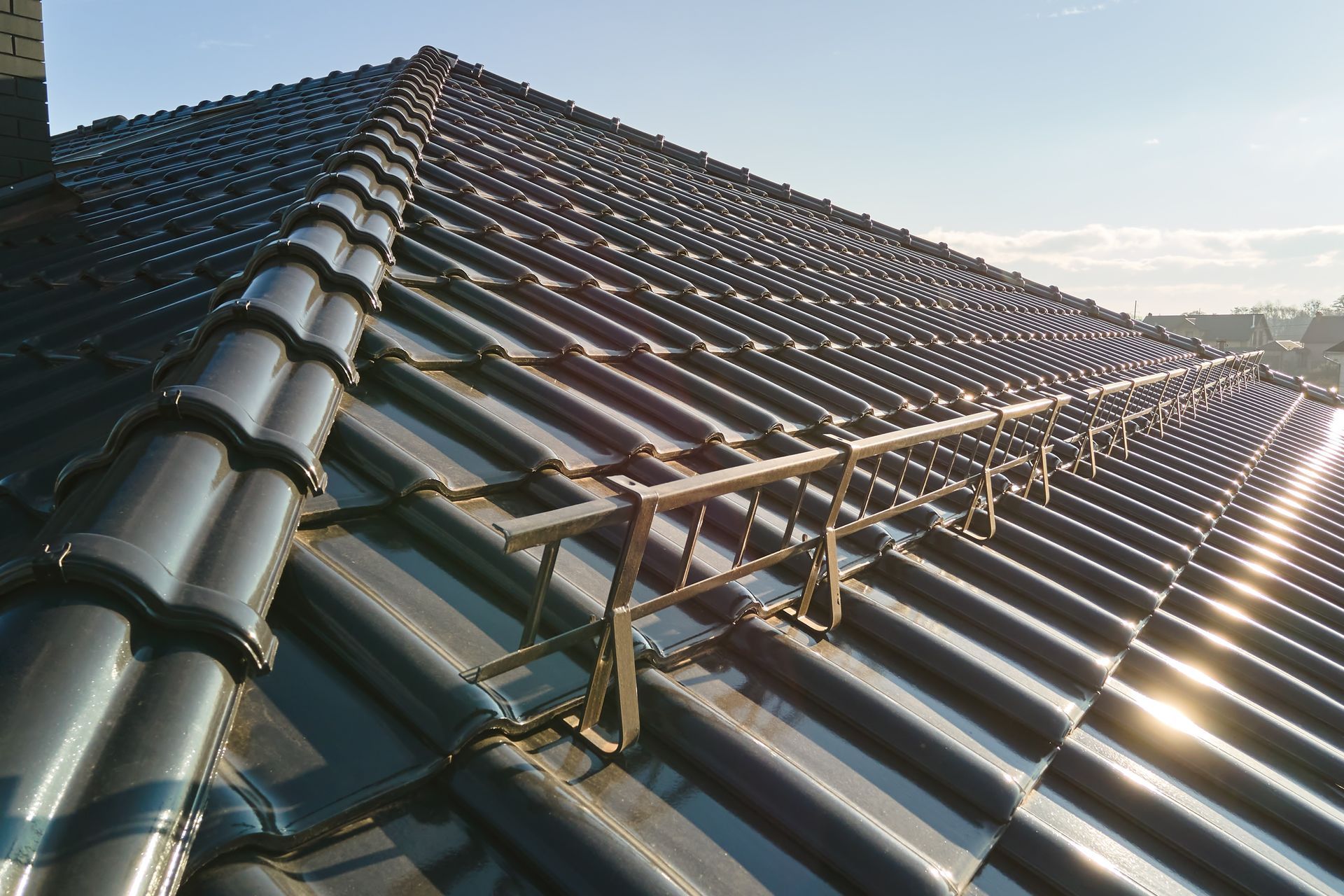 A roof with a metal railing attached to it