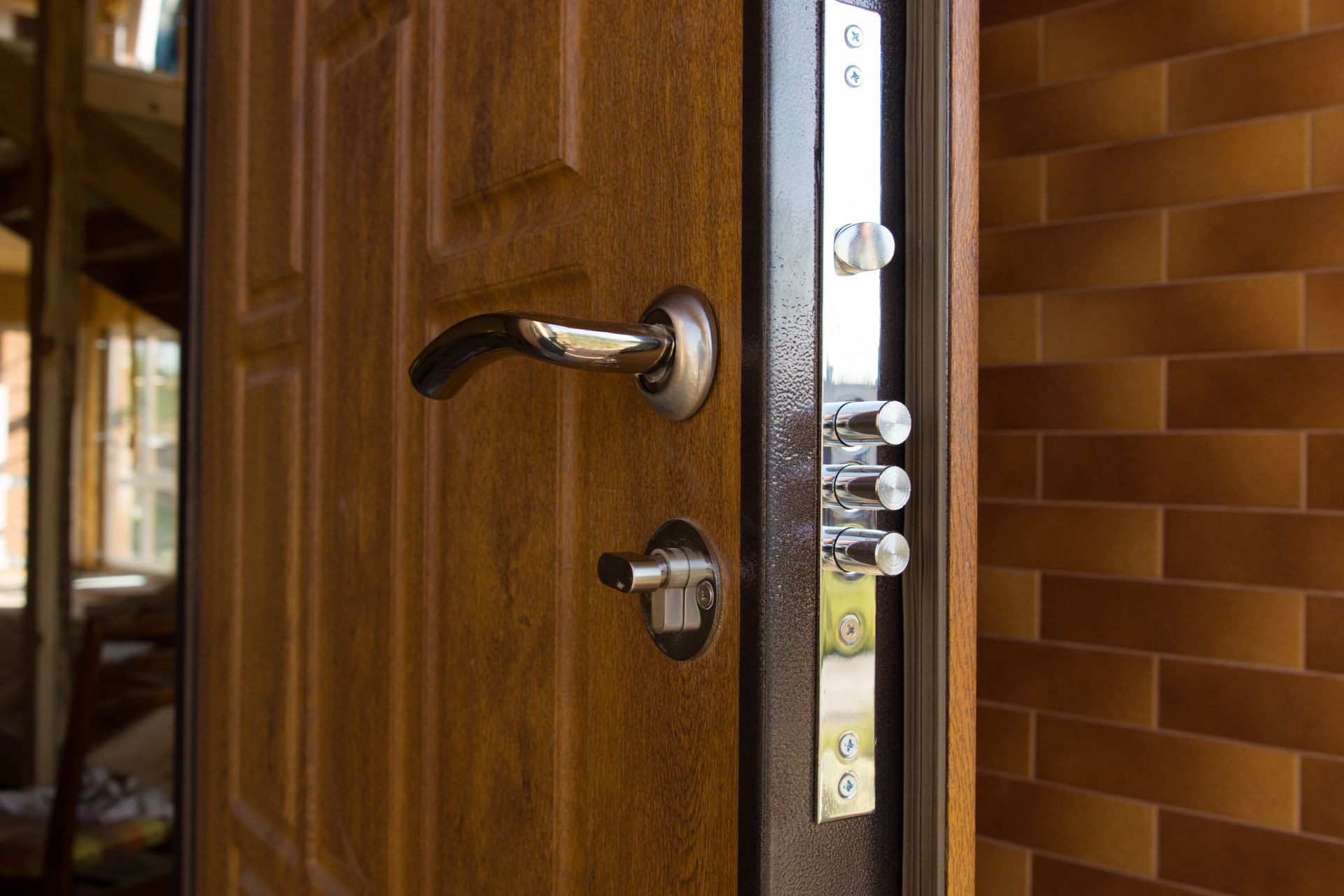 A close up of a door with a handle and a lock.