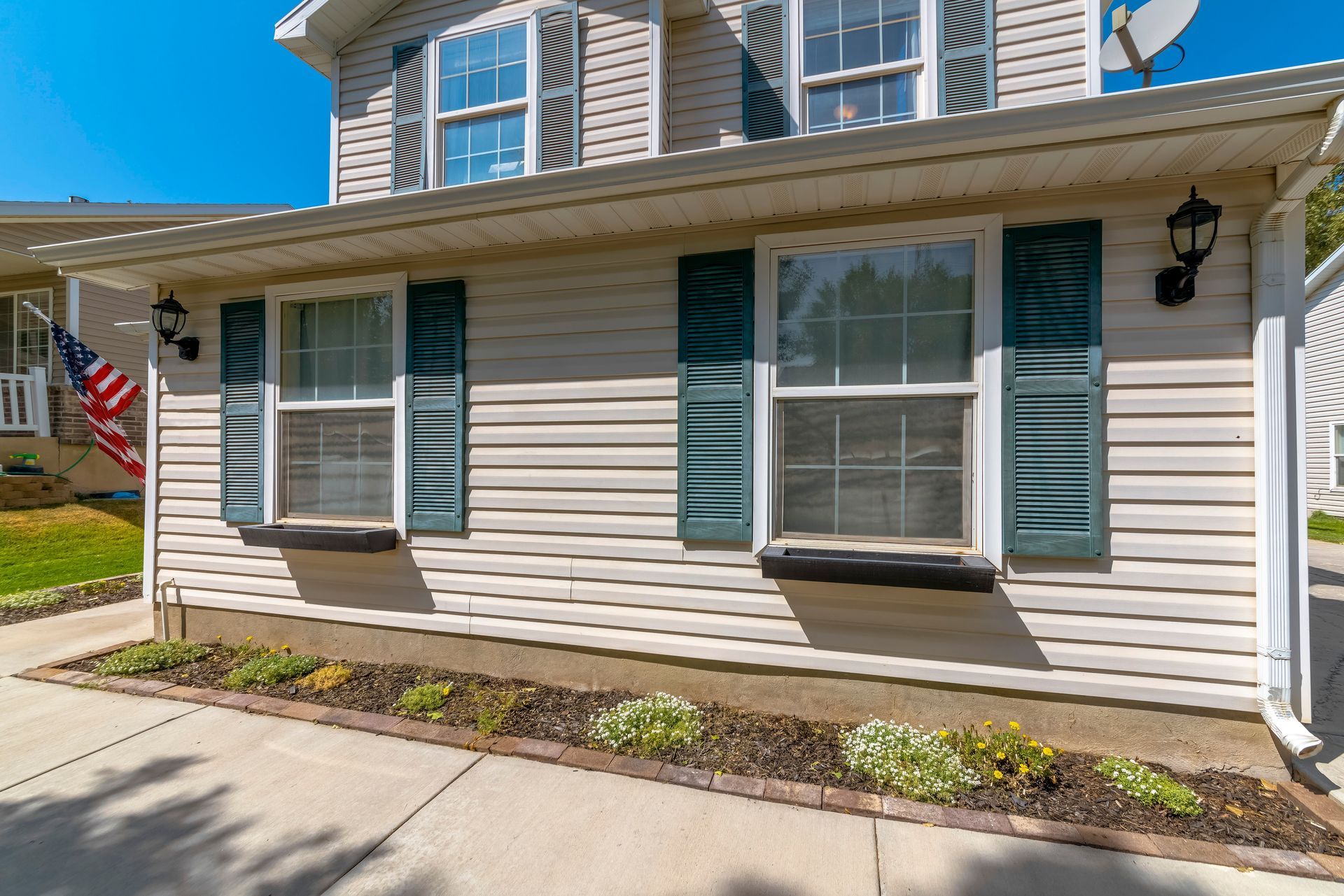 A mobile home with a lot of windows and shutters.